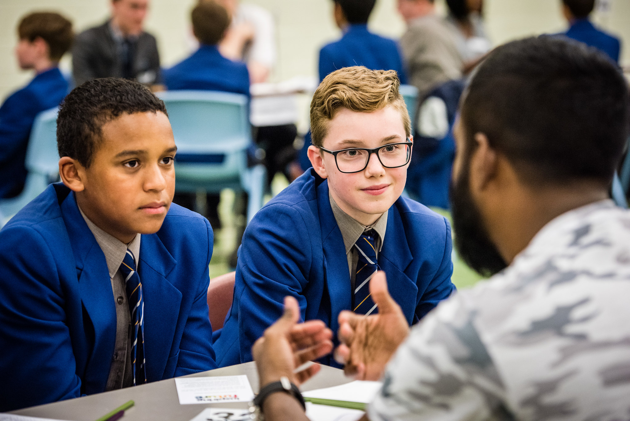 Boys talking to volunteer