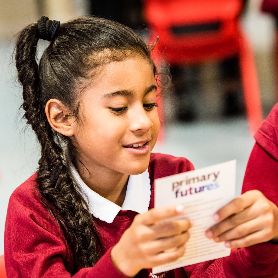 Girl reading Primary Futures card