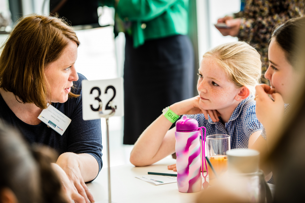 Volunteer engaging with pupils