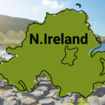Map of Northern Ireland set on top of a landscape of the Giant's Causeway in the background on a sunny day.